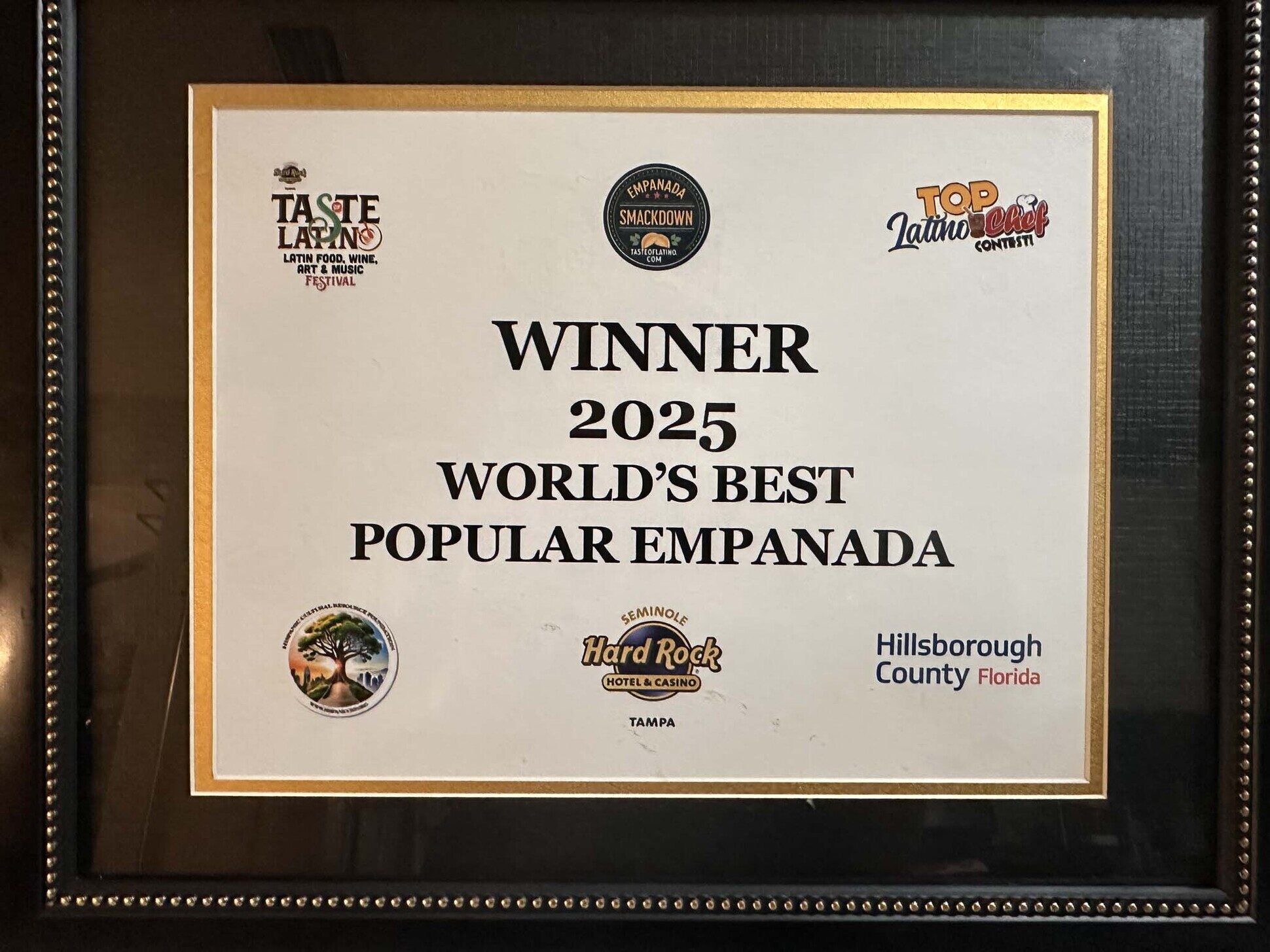 Framed certificate: Winner 2025 World's Best Popular Empanada, Taste Latino Empanada Smackdown at Seminole Hard Rock Hotel Tampa